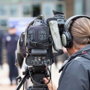 Camera man filming a scene